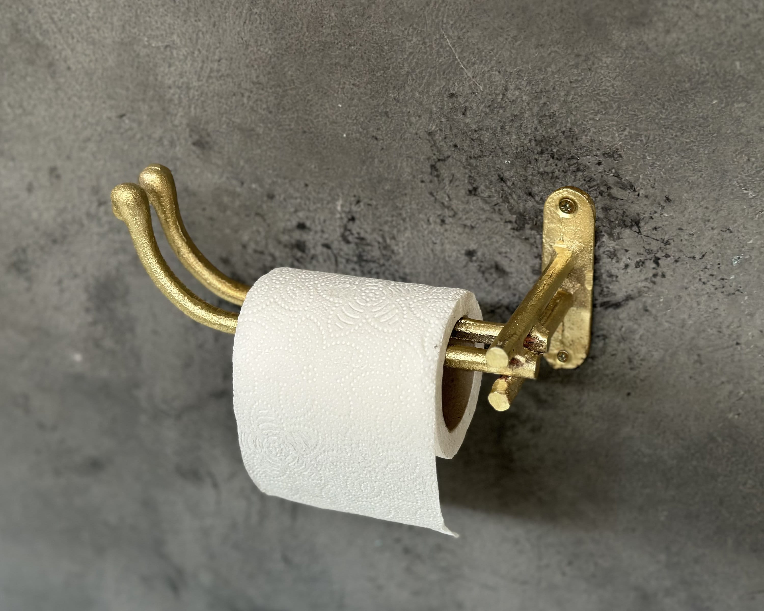 Unlacquered brass toilet paper holder